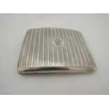 A Horace Woodward & Co. Ltd silver cigarette case, engine-turned striped detail, A.I cartouche,