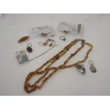 A quantity of amber jewellery including necklace, earrings, bangles, ring etc.