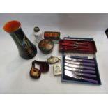 Two boxes of mixed items including bakelite, cutlery and napkin rings