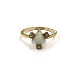 A 9ct gold opal and pearl ring with trillion cut opal to centre and seed pearl set to each side.