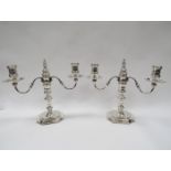 A pair of James and Son silver three sconce candelabra of Georgian style, removable sconces,