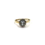 A 9ct gold diamond and pale blue stone cluster ring. Size P/Q, 2.