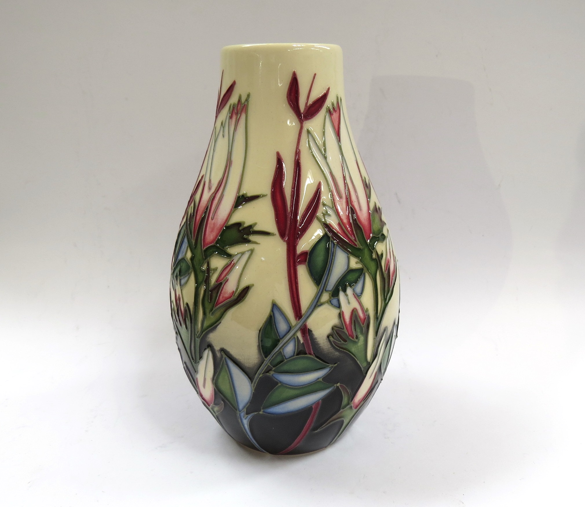 A Moorcroft vase designed by Paul Hilditch, small pink flowers 2/25, 13cm tall,