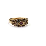 A 9ct gold ruby and diamond gypsy style ring. Size P, 2.