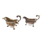 A pair of George III silver sauce boats, scrolled handles, gadrooned rims, shell relief, hoof feet.