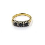 An 18ct gold sapphire and diamond ring. Size P, 3.