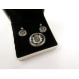 A Victorian silver brooch and earrings set with British Coat of Arms design,