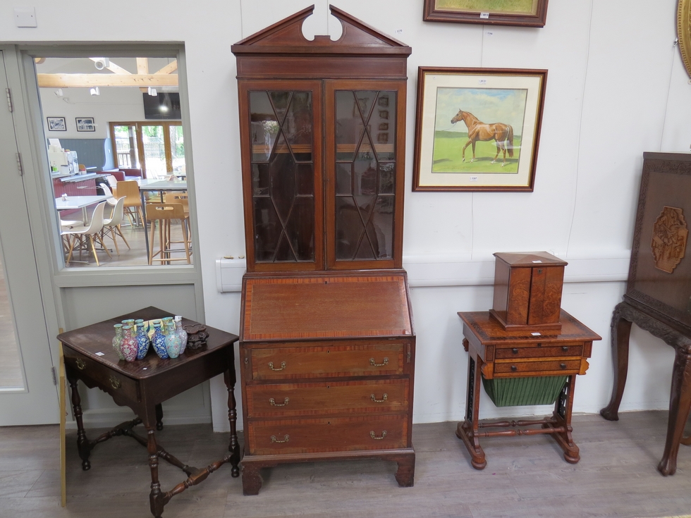 An Edwardian mahogany bureau bookcase, crossbanded front, astragal glazed top, broken arch pediment,