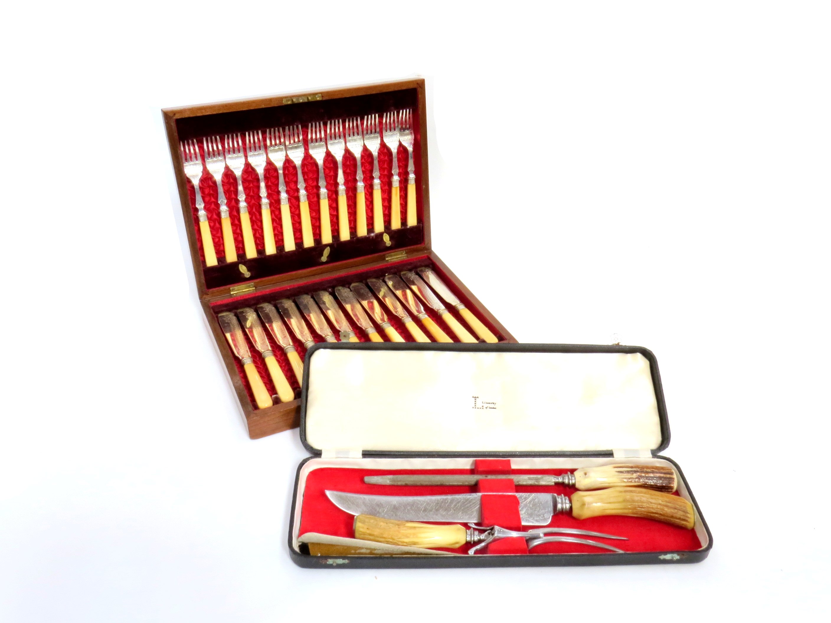 A cased Liberty of London carving set and a cased set of fish knives and forks