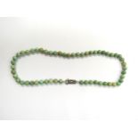 A jade bead necklace with Art Deco silver and marcasite clasp,