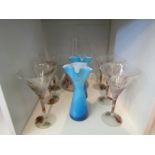 A set of six martini style glasses with splatter design, matching jug, and a pair of blue glass