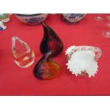 Three sculptural glass ornaments and a glass basket