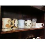 A collection of commemorative cups/mugs and a glass including Wedgwood, Richard Guyatt, etc (9)