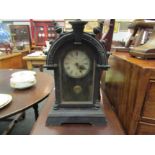 A UCC mantel clock with pendulum and key. 51cm height