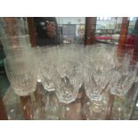 A collection of cut glass tumblers including Waterford crystal