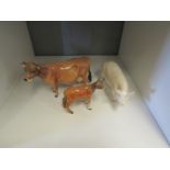 A Beswick cow and calf, (calf a/f), and a Champion wall queen sow (3)
