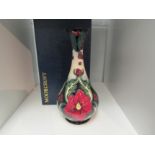 A Moorcroft Ruby pattern vase designed and signed by Rachel Bishop, No.105, 23cm tall, boxed