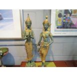 A pair of verdigris and gilt deity figures, approximately 72cm tall