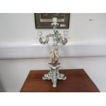 A 19th Century Sitzendorf porcelain four sconce candelabra with putti holding cricket bats on ornate