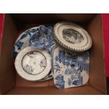 A tin glazed blue and white plate, two transferware square drainers/teapot stands, four bat