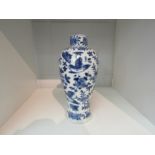 A Chinese blue and white painted vase, four character marks to base a/f, 19cm high