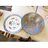 Two Iznik style dishes with floral designs, a/f