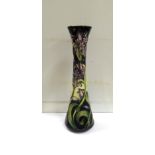 A Moorcroft slender vase decorated with blue flowers, designed by Emma Bossons, 31cm tall, boxed
