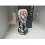 A Moorcroft vase by Sandra Dance No.40, decorated with forget-me-nots, 16cm tall, boxed
