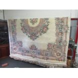 A large modern Chinese rug with foliate design