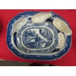 A large blue and white "Willow" pattern transferware meat platter, "Willow" pattern gravy boats, etc