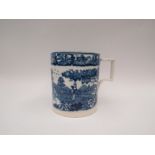 A large mug/tankard with blue and white transferware decoration, paper label to base " '