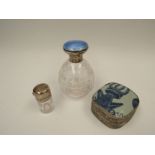 An enamel and silver topped glass scent bottle, a/f and a smaller silver topped example. An