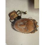 An African, possibly Gabonese, small ceremonial carved wooden mask and a small leather pouch with