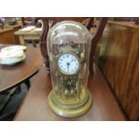 A brass anniversary clock with dome. overall 31cm height. With key. a/f