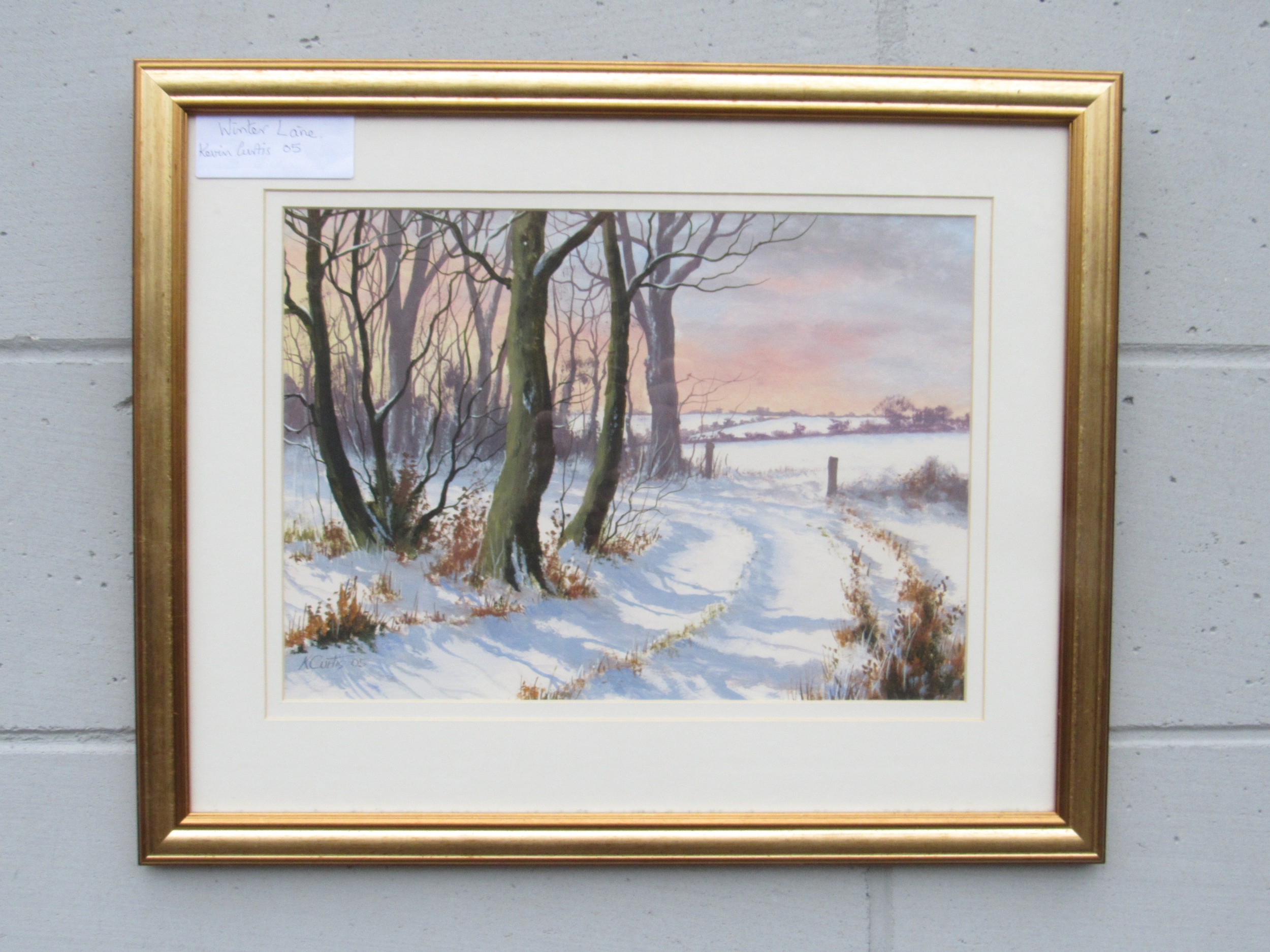 KEVIN CURTIS (1958-2009) A framed & glazed oil on card, 'Winter Lane'. Signed bottom right and dated