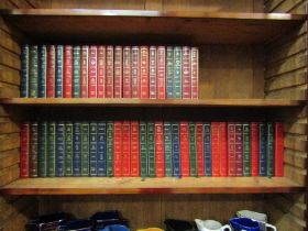 53 Readers' Digest First Edition Condensed Books with decorative gilt decorated hardback covers.
