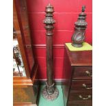 A Victorian mahogany tulip carved lamp stand together with a smaller version, possibly made from