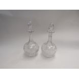 A pair of crystal glass decanters with stoppers