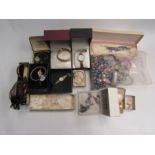 A large quantity of costume jewellery including brooches, earrings, bracelet, watches, etc