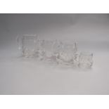 A graduated set of four crystal jugs