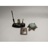 A desk calendar with golf figure, cigarette case with Norwich crest and a turtle form magnifier (3)