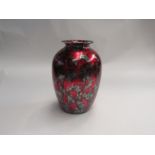 A red and silvered glazed vase, 25cm tall