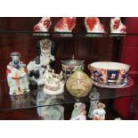 A Staffordshire king charles spaniel, Staffordshire figure with bird and dog, biscuit barrel, plate,