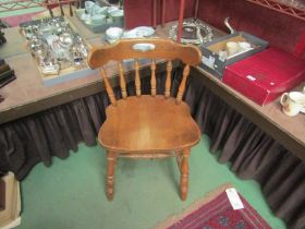 A pine captain's chair on turned legs to 'H' stretcher base