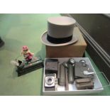 A boxed top hat, reproduction cast iron money box, walking sticks, camera etc.
