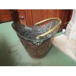 An Arts & Crafts/Art Nouveau copper coal bucket with brass handle