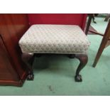 A George III style mahogany stool the needlepoint seat over ball in claw cabriole legs