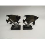 A pair of cast metal fish ornaments and a pair of Deco pheasants (4)