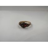 A 9ct gold garnet cluster ring, size P, 2.7g