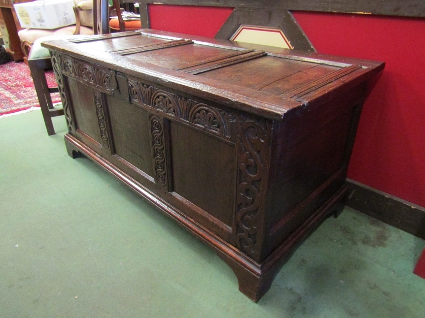A 17th Century and later oak three panel coffer the split hinged rising top over a carved front on - Image 3 of 4